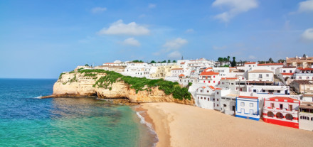 Portuguese villa in Carvoeiro beach with clear blue sea. In the
